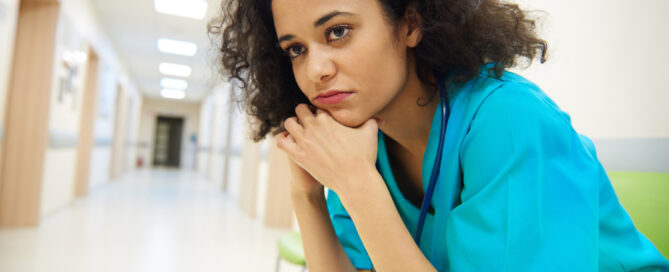 nurse sitting with folding hand stressed